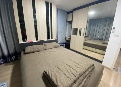 Modern bedroom with double bed and mirrored wardrobe