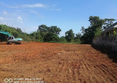 Clear land with construction equipment