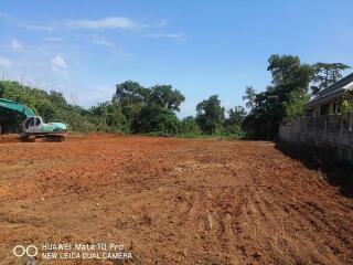 Clear land with construction equipment