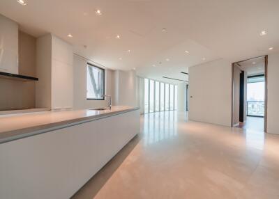 Modern kitchen with island, ample natural light, and open space