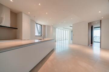 Modern kitchen with island, ample natural light, and open space