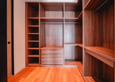 Spacious Walk-in Closet with Wooden Shelving