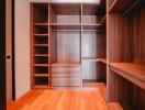 Spacious Walk-in Closet with Wooden Shelving