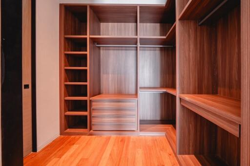 Spacious Walk-in Closet with Wooden Shelving