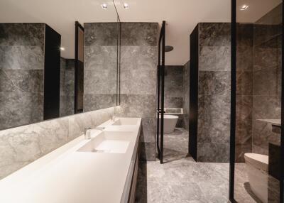 Modern bathroom with marble tiles and double sink