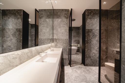 Modern bathroom with marble tiles and double sink