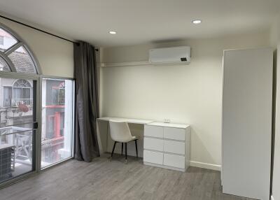 Modern bedroom with study desk and air conditioning