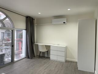 Modern bedroom with study desk and air conditioning