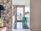 Modern kitchen with floral wallpaper and green stools