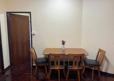 Dining area with a wooden table and four chairs