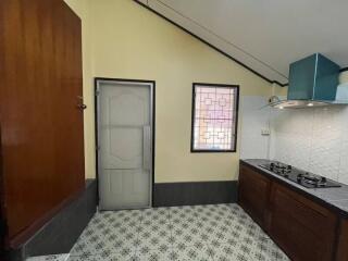 Modern kitchen with stove and window