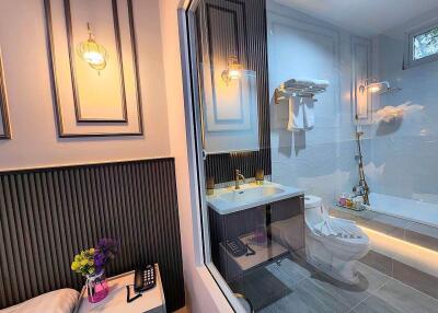 Modern bathroom with decorative lighting and shower