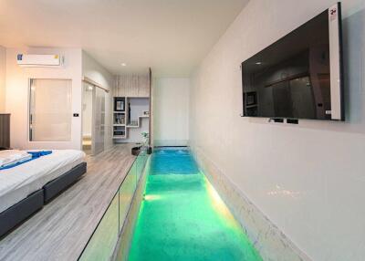 Bedroom with indoor pool and modern amenities