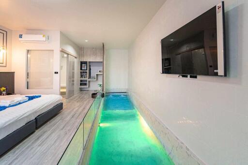 Bedroom with indoor pool and modern amenities