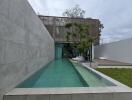 Modern outdoor area with a pool and lounging space