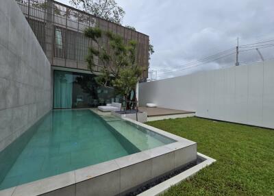 Modern backyard with pool and sitting area