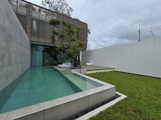 Modern backyard with pool and sitting area