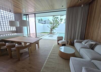 Modern living room with dining area and outdoor view