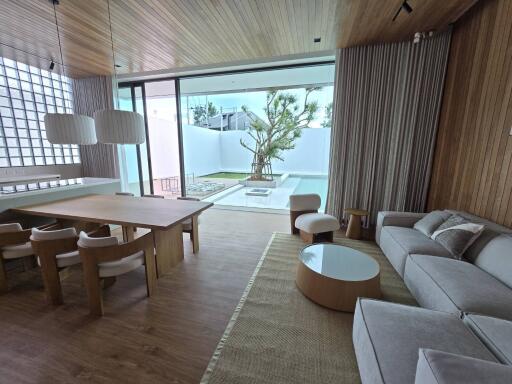 Modern living room with dining area and outdoor view