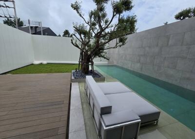 Modern outdoor area with pool and seating