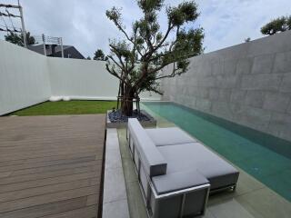 Modern outdoor area with pool and seating