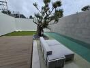 Modern outdoor area with pool and seating