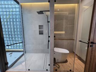 Modern bathroom with glass shower and toilet