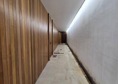 Modern hallway with wooden paneling and lighting