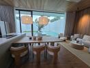 Modern living room with wooden ceiling, dining area, and view of outdoor pool