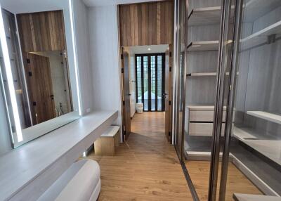 Spacious walk-in closet with modern lighting and ample storage