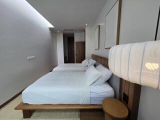 Bedroom with two beds and modern decor