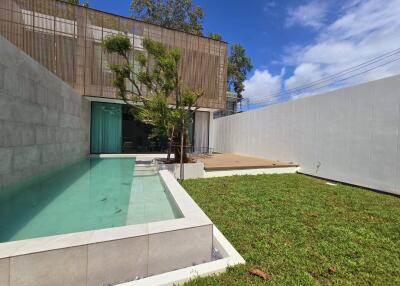 Modern house with pool and lawn