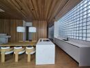 Modern kitchen with wooden elements and glass brick windows