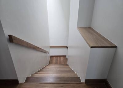 Wooden staircase with railing