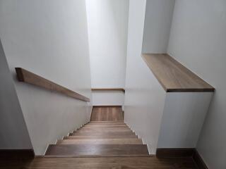 Wooden staircase with railing