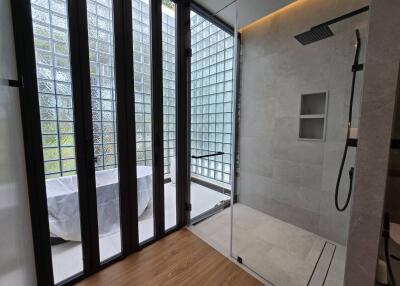 Modern bathroom with glass wall and shower area