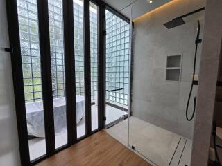 Modern bathroom with glass wall and shower area