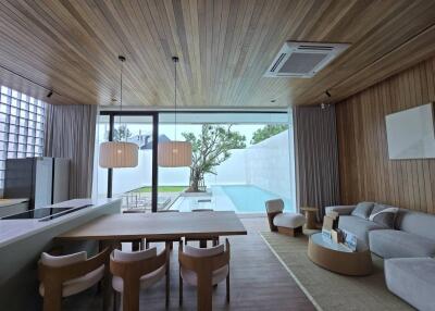 Spacious living room with pool view