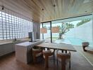 Modern kitchen with dining area and view of outdoor pool