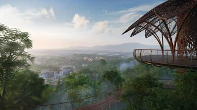 A balcony with a panoramic view over a lush forest and distant buildings