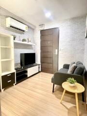 Modern small living room with TV and air conditioner