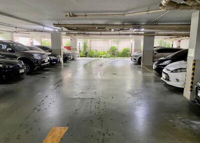 Indoor parking garage with multiple cars