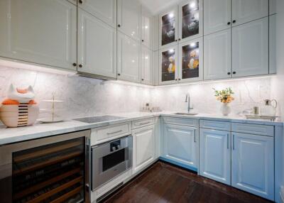 Modern kitchen with white cabinets and appliances