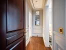 Elegant hallway with wooden flooring and wainscoting