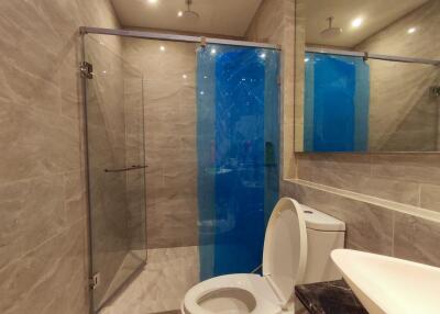 Modern bathroom with glass shower and toilet