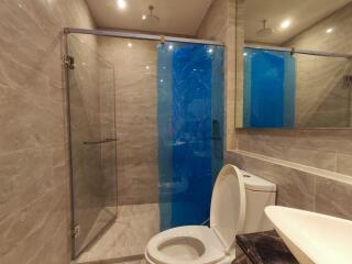 Modern bathroom with glass shower and toilet