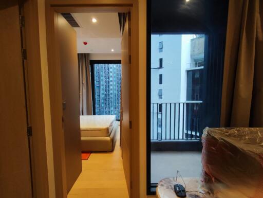 Bedroom with adjacent balcony and city view