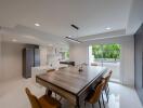 Modern dining area with kitchen view.