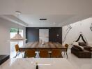 Modern dining area with a large wooden table, stylish lighting, and a partial view of the living room