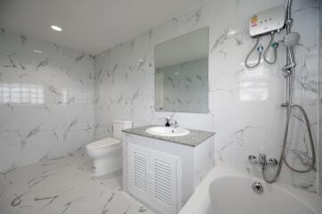 Modern bathroom with white marble tiles